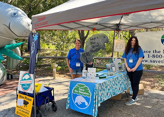 Volunteers Tonya Bernhard (left) and Sarah Chair (right) at Save the Manatee Club’s booth at NatureFest. Photo courtesy SMC.