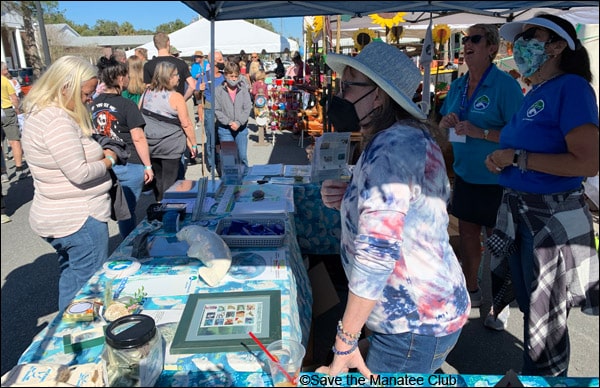 Volunteers Jane F., Trinket M., and Kiki S. at the Florida Manatee Festival in Crystal River, Florida. January 15, 2022.