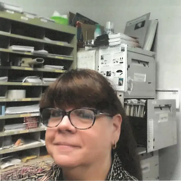 A photo of Judy Bower in Save the Manatee Club's mailroom.