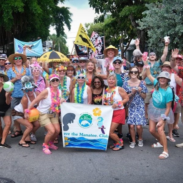 A group photo of Save the Manatee Club volunteers and supporters who walked in the Second Line Parade in Key West on Jimmy Buffett Day.