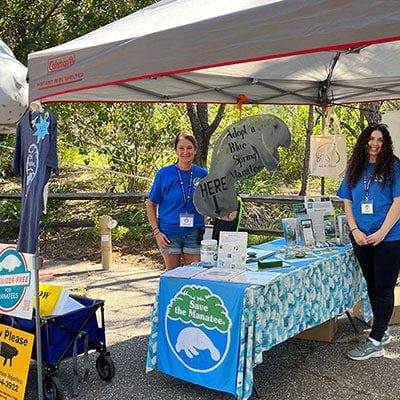 Volunteers Tonya Bernhard (left) and Sarah Chair (right) at Save the Manatee Club’s booth at NatureFest. Photo courtesy SMC.